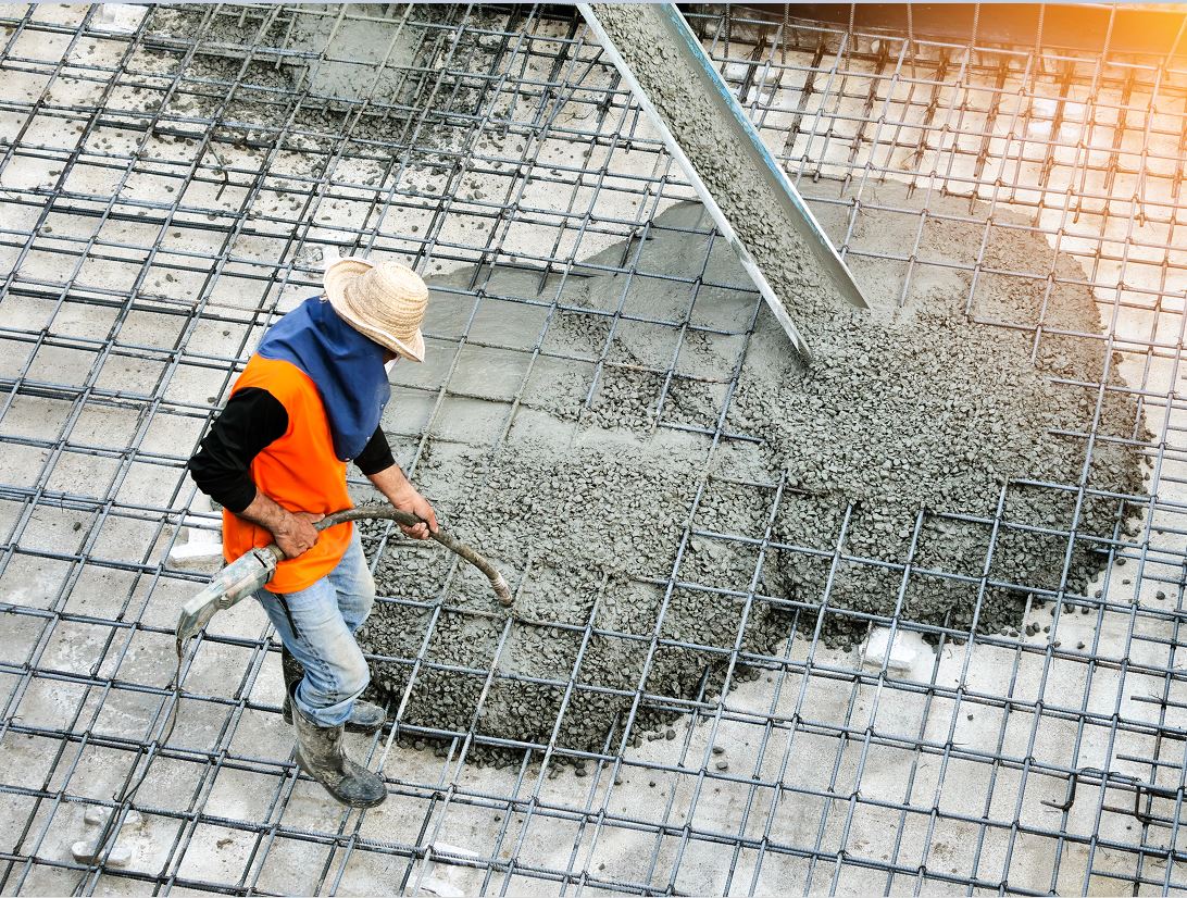 Image of worker with self-consolidating concrete